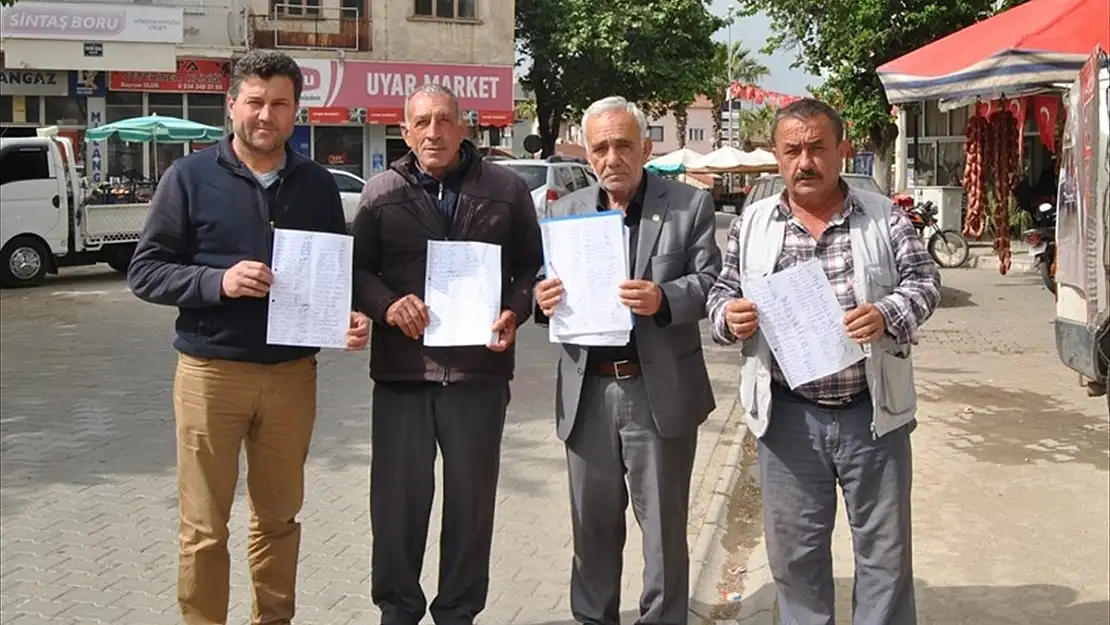 MAHALLE SAKİNLERİ BAŞKA İLÇEYE BAĞLANMAK İÇİN İMZA TOPLUYOR