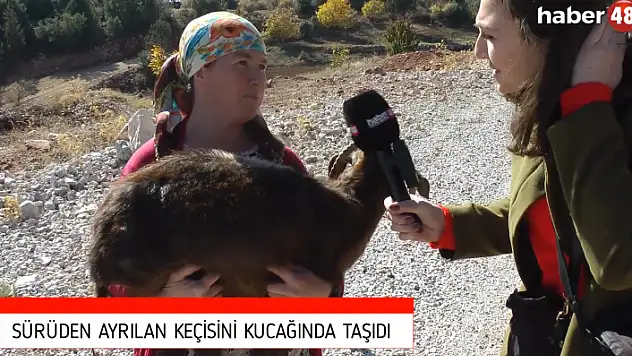 HASTALANAN KEÇİSİNİ KUCAĞINDA TAŞIDI
